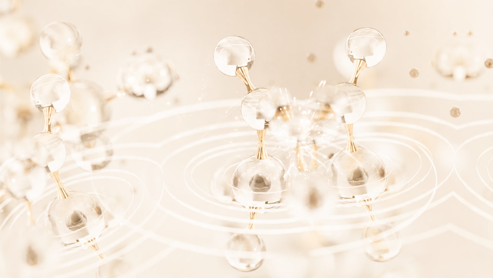 Gold and glass molecular forms in a warm cream landscape